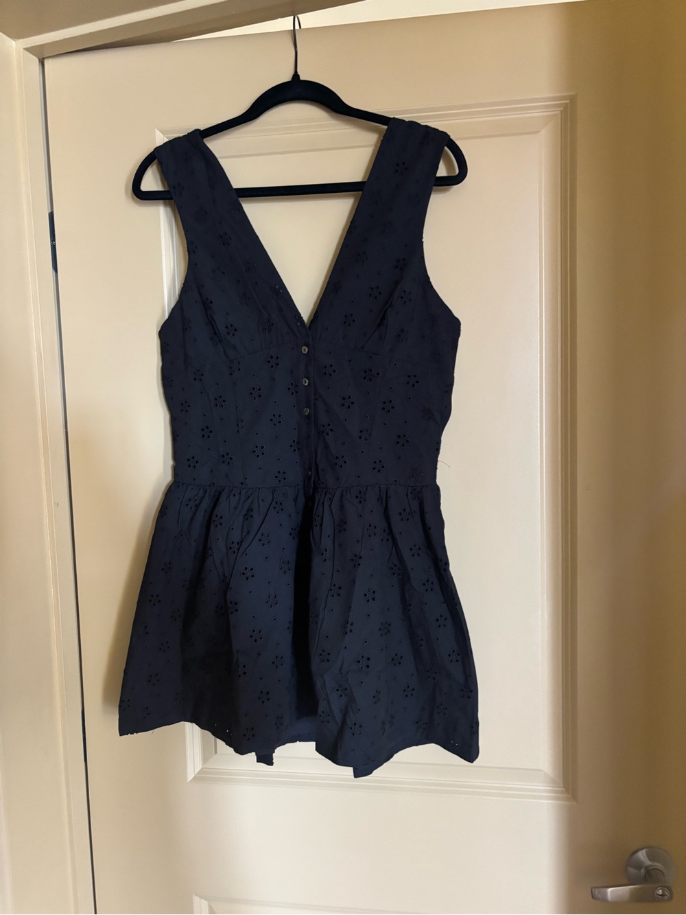 Frankie’s Bikinis Sleeveless Eyelet Mini Dress in Black